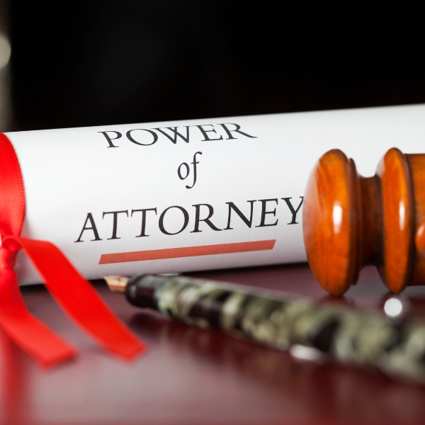 power of attorney scroll and pen